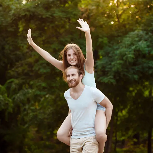Man carrying woman